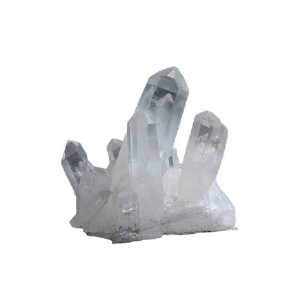 Close-up of natural clear quartz cluster, multiple raw white quartz crystal points