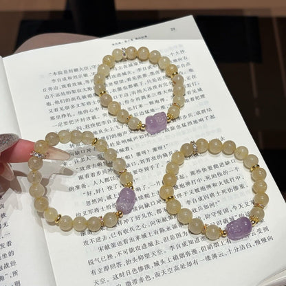 Hand‑made gold-rutile-amethyst beaded bracelet with gold metal accents, wholesale bulk