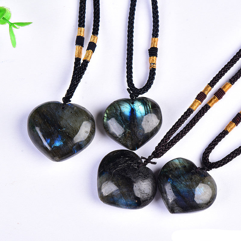 Close-up of blue flash natural labradorite heart crystal pendant