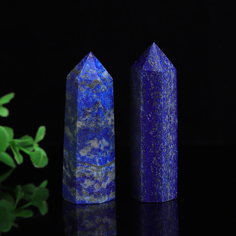 Natural lapis lazuli crystal tower point, polished deep blue hexagonal obelisk with pyrite flecks
