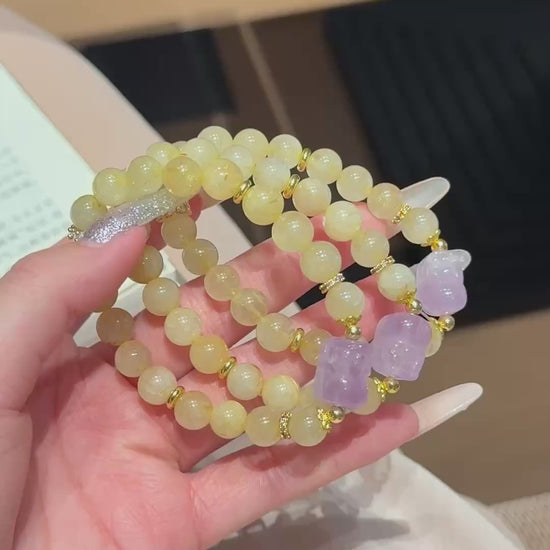 Hand‑made gold-rutile-amethyst beaded bracelet with gold metal accents, wholesale bulk