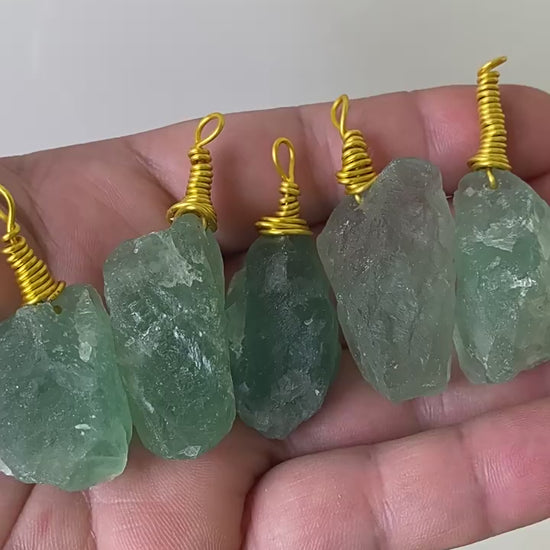 Video showing bulk natural raw green fluorite wire wrapped pendants for crystal jewelry wholesale