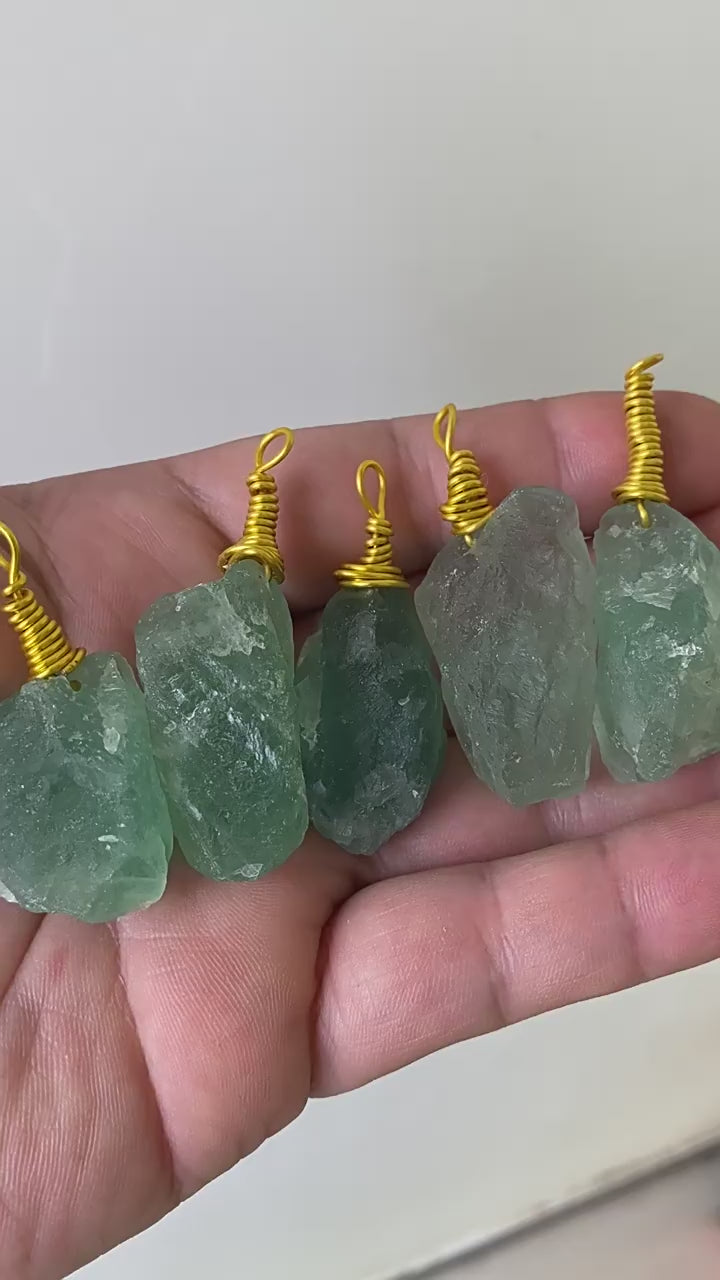 Video showing bulk natural raw green fluorite wire wrapped pendants for crystal jewelry wholesale