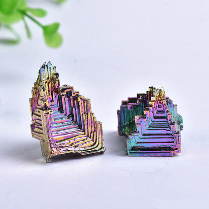 Detailed shot of lab-grown rainbow bismuth crystal, distinctive stepped geometric metal crystal formation