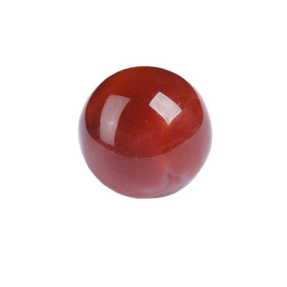 Red silk agate crystal sphere isolated on plain white background