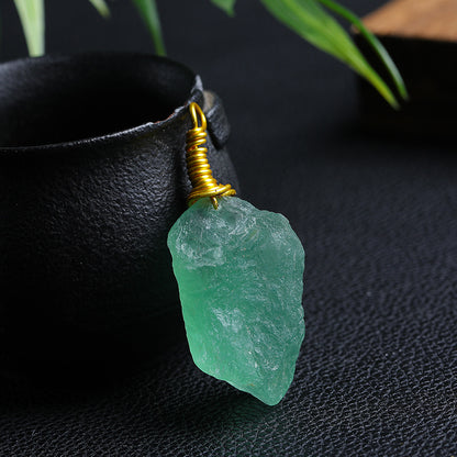 Single Raw Green Fluorite Wire Wrapped Pendant on Dark Background